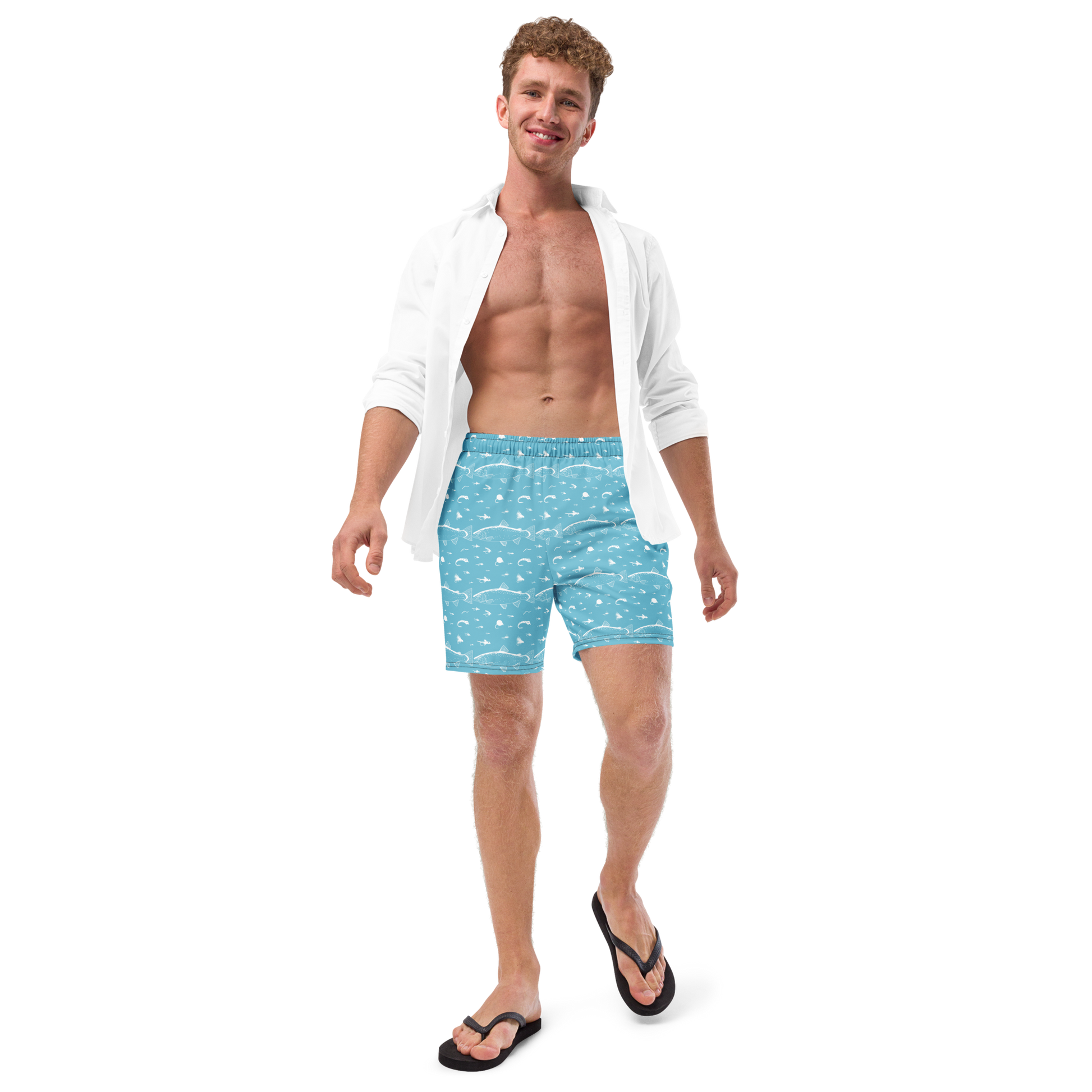 Blue fly fishing shorts / swim trunks. They have a pattern with trout and flies. Model wearing shorts