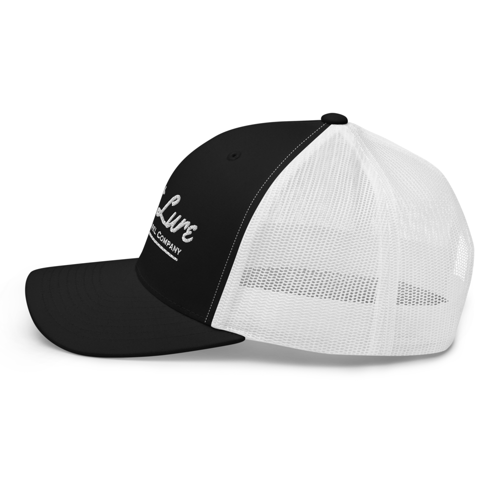 Black and white Lost lure fishing trucker hat. Left side