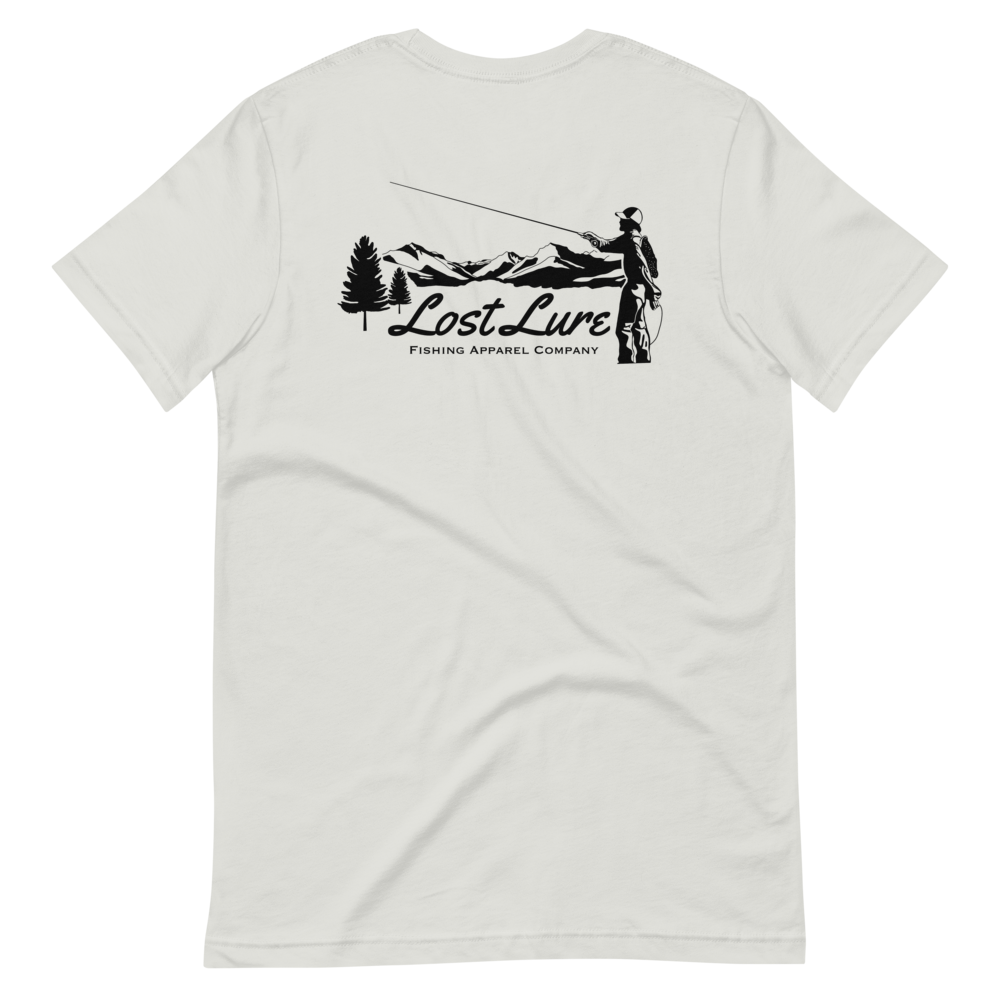 Fly fishing Lost lure shirt. It has a design on the back of the shirt black and white outline a fly fisherman and the Rocky Mountains. Crème fishing shirt, back side