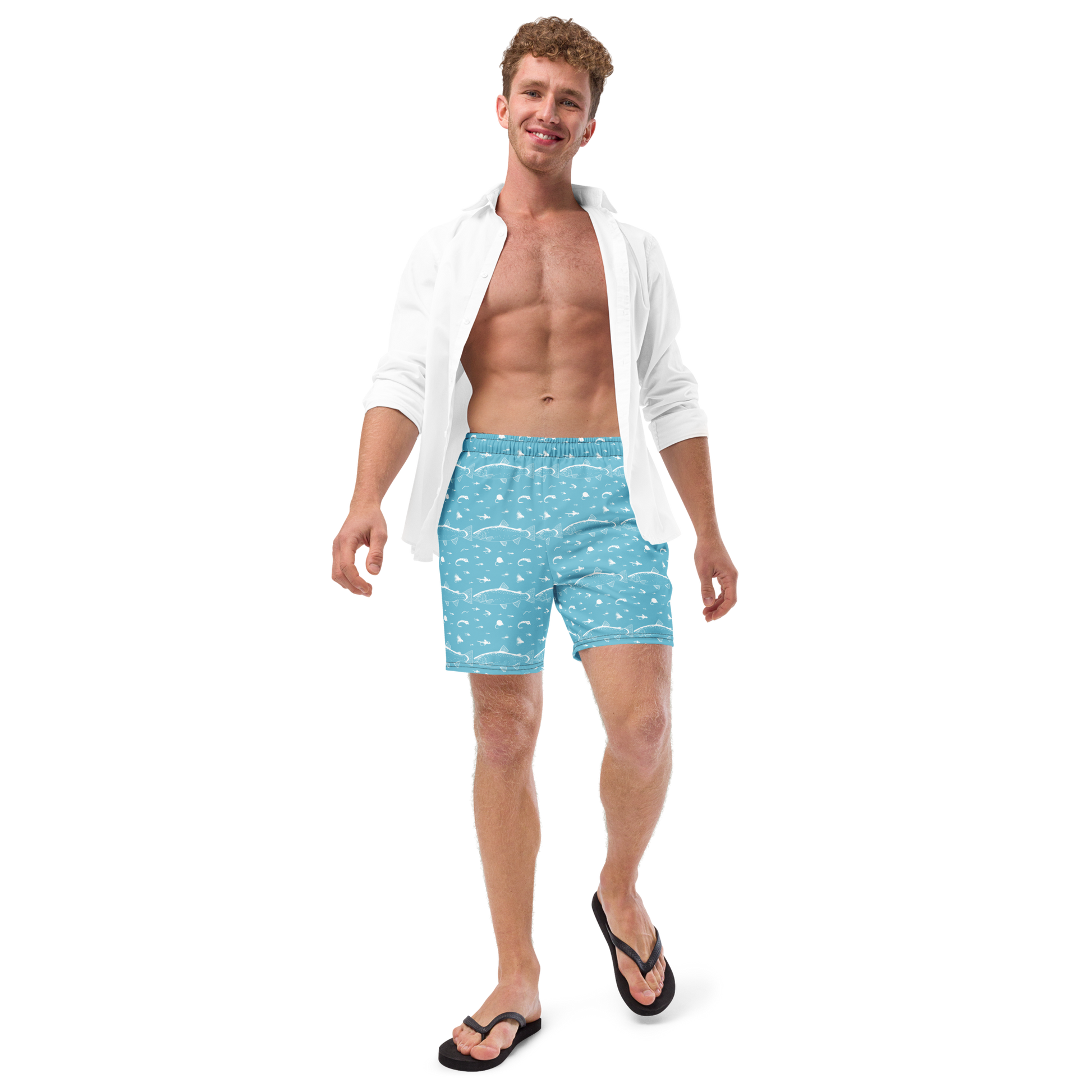 Blue fly fishing shorts / swim trunks. They have a pattern with trout and flies. Model wearing shorts 