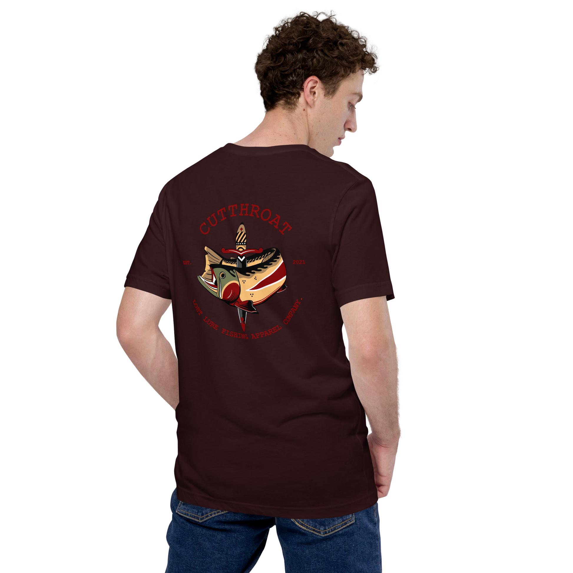Cutthroat Trout fishing shirt. It’s an American traditional style design with a cutthroat trout and a dagger. The shirt reads Cutthroat trout, est. 2021, lost lure fishing apparel company. The front of the shirt has the lost lure logo. Dark maroon shirt, back side of model wearing shirt.