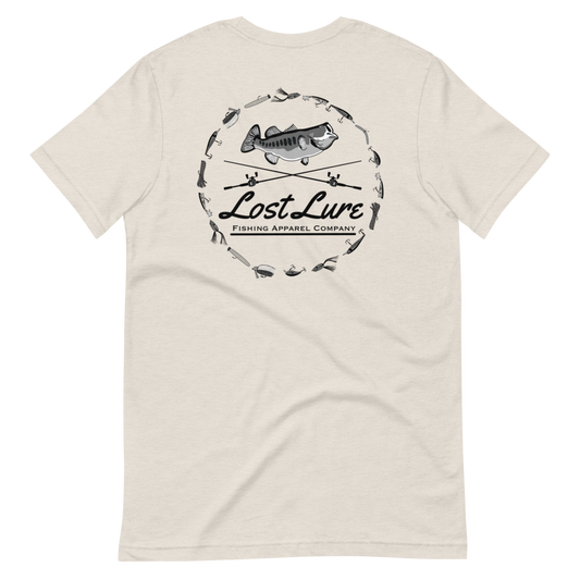 A largemouth bass fishing shirt with a design on the back if a bass, fishing rods and fishing lures. It reads “Lost Lure Fishing Apparel Company”. This shirt is cream color, back side