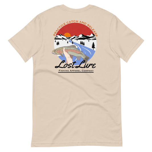 Lost Lure Fishing T-shirt with design that reads “practice catch and release” it has a rainbow trout being released in a river in snowy mountains. Light brown shirt, back side