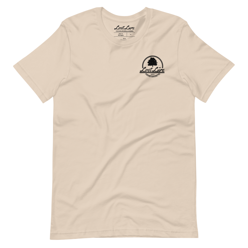 Fly fishing Lost lure shirt. It has a design on the back of the shirt black and white outline a fly fisherman and the Rocky Mountains. Crème fishing shirt, front side
