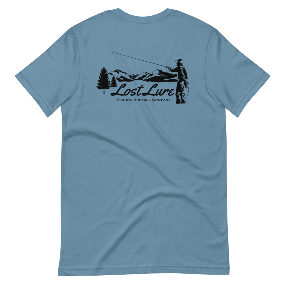 Fly fishing Lost lure shirt. It has a design on the back of the shirt black and white outline a fly fisherman and the Rocky Mountains. Blue fishing shirt, back side